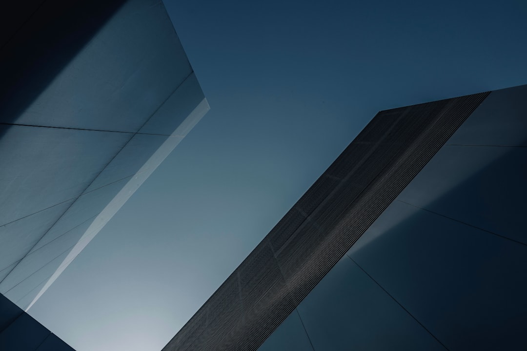 a tall building with a sky in the background
