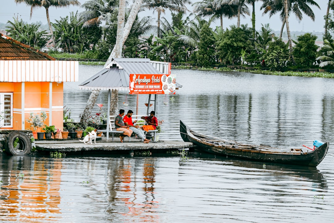 a couple of boats floating on top of a lake