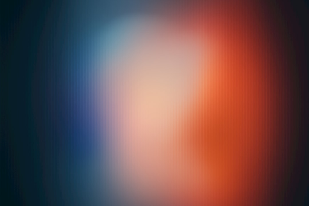 Blurred blue, white, and red colors.