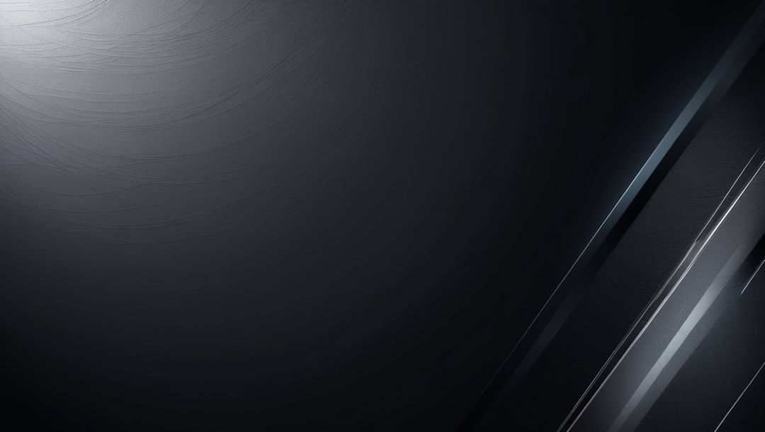Abstract dark grey surface with subtle curved lines and diagonal light streaks
