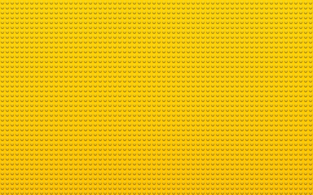 a yellow background with small dots